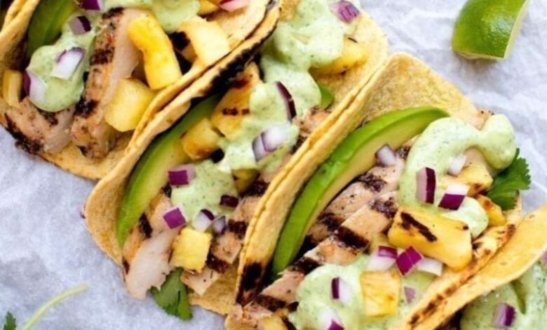 Grilled pineapple chicken tacos with avocado crema