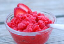 Strawberry granita with pistachios and cream