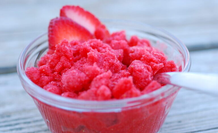 Strawberry granita with pistachios and cream