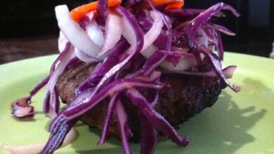 Spicy burgers with tahini sauce and harissa carrot slaw