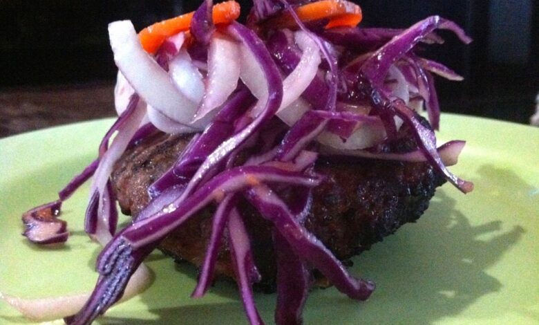 Spicy burgers with tahini sauce and harissa carrot slaw