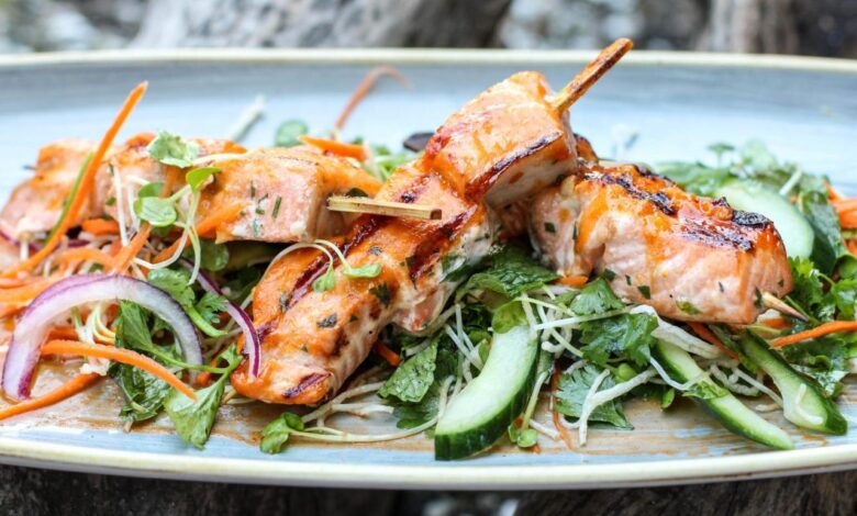 Curry rubbed salmon skewers with spinach raita