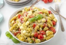 Pesto pasta salad with tomatoes and mozzarella