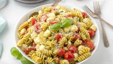 Pesto pasta salad with tomatoes and mozzarella