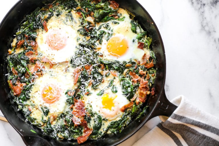 Baked eggs with wilted baby spinach