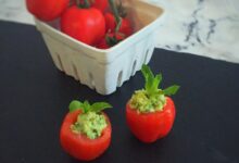 Avocado hummus stuffed tomatoes