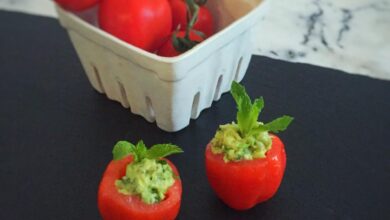 Avocado hummus stuffed tomatoes