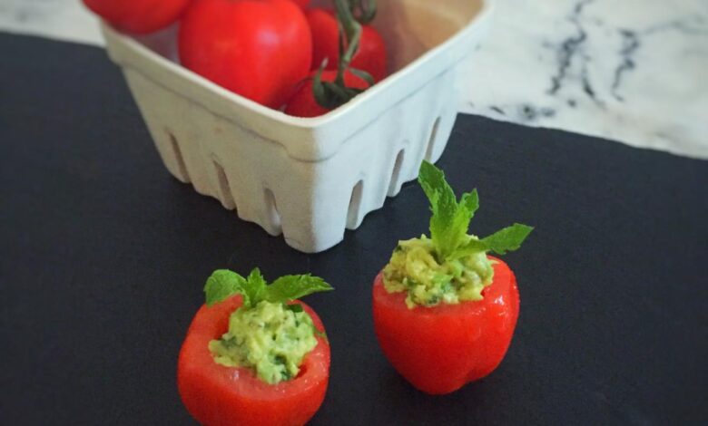 Avocado hummus stuffed tomatoes