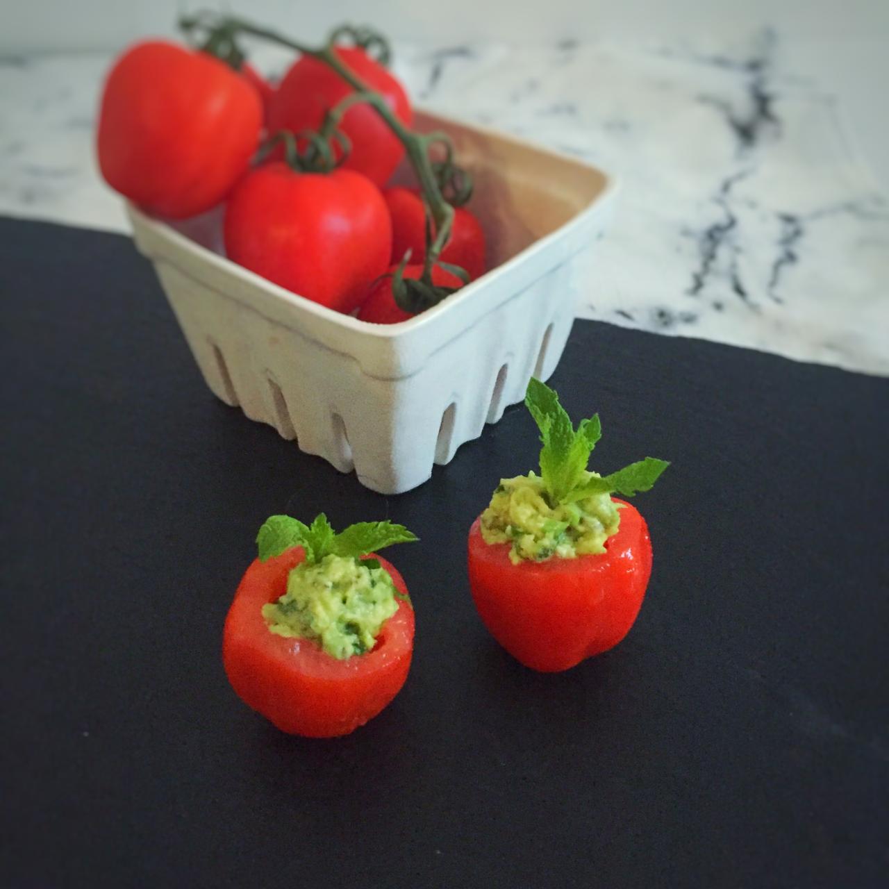 Avocado hummus stuffed tomatoes