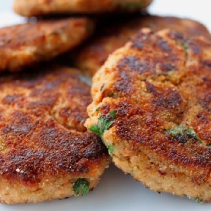 Salmon cakes on mixed green salad