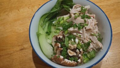 Poached chicken with steamed veggies and peanut sauce