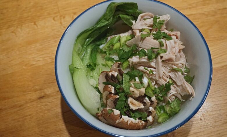 Poached chicken with steamed veggies and peanut sauce