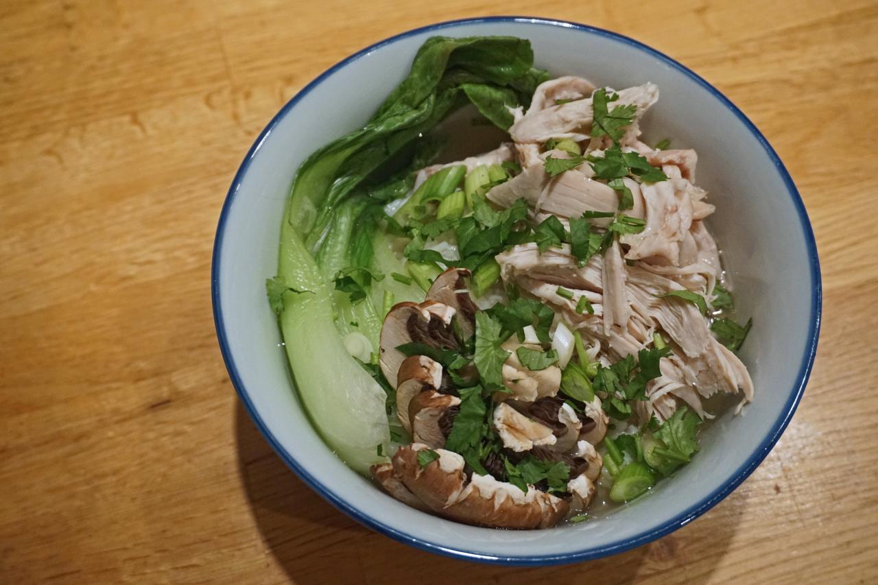 Poached chicken with steamed veggies and peanut sauce