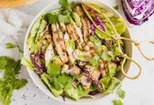 Shredded vegetable salad with sesame chicken strips