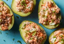 Coconut poached salmon stuffed avocados